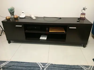 Dark wood TV entertainment unit with storage cabinet