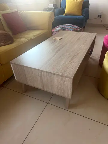 Light wood rectangular coffee table with storage shelf - good condition