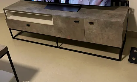 Modern concrete-look TV cabinet with metal frame