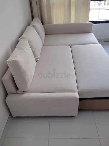 Light beige L-shaped sofa bed - good condition