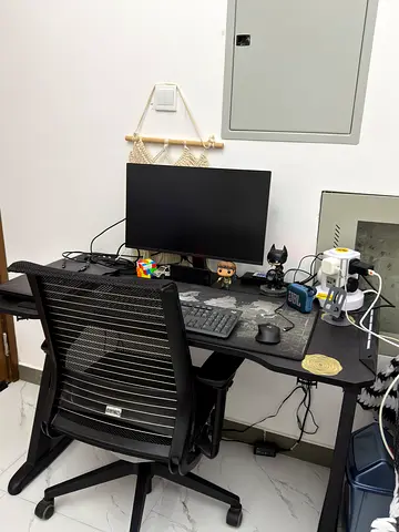 Ergonomic mesh office chair with black desk setup (brand new gamer desk)