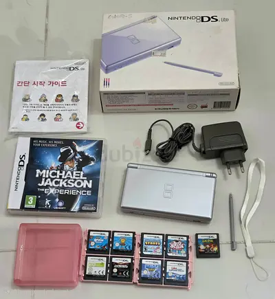 Silver Nintendo DS Lite bundle with charger, styluses, 10 games + box