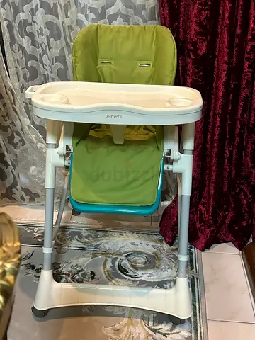 Used adjustable baby high chair with tray - green/white