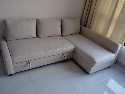 Light beige L-shaped sofa with storage, good condition