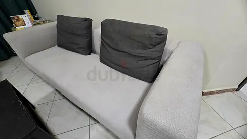 Light grey 3-seater sofa with dark removable cushions