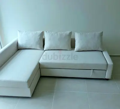 Light grey L-shaped sofa with storage, good condition