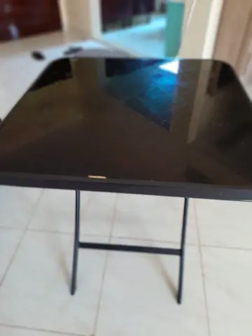 Simple black folding table with metal legs - used
