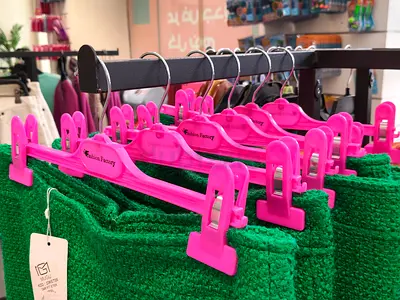 Set of pink plastic clip hangers (10+) for skirts/trousers