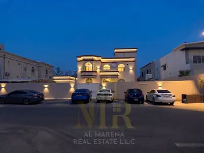 Villa for sale in Al Rawda 2 | 10,000 sq. ft., two stories plus a roof terrace; features 6 bedrooms, 3 living areas, and an external annex. Freehold o