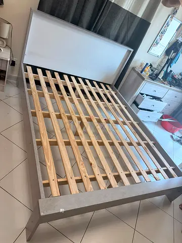 Queen-size wooden slatted bed frame with headboard - good condition.. Mattress for free