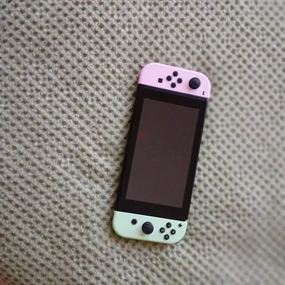 Nintendo Switch (handheld) with pastel pink & mint Joy-Cons - good condition