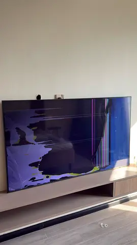 Damaged 65 - inch TV with cracked screen - for parts or repair. 165 cm . Screen is broken