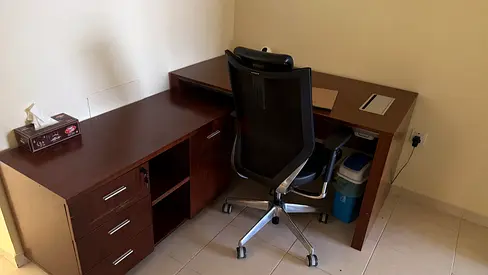 L-shaped wooden office desk with storage and ergonomic chair (used)