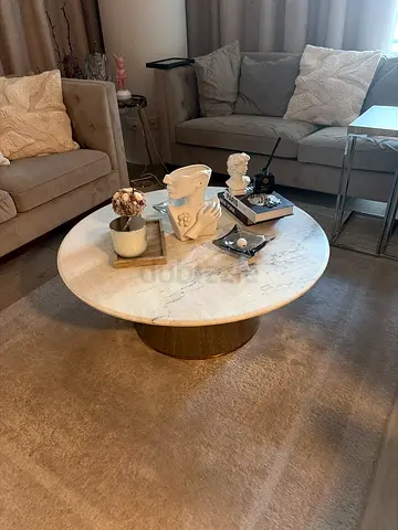 Coffee table used marble white . Trendy and almost new ,