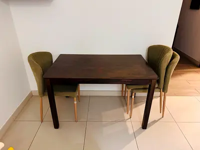 Small dark wood dining table with 4green upholstered chairs - excellent condition