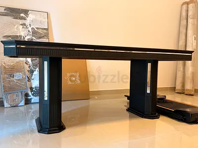 dark grey dining table with decorative legs and marble top -mk kabbani furniture originally 4000 AED