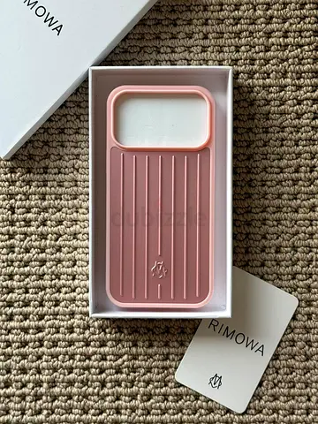 Rimowa pink cover.