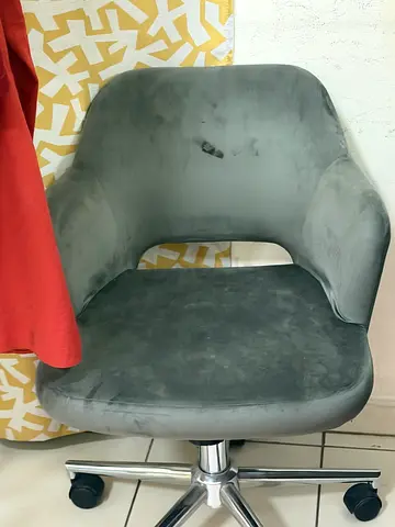 Grey velvet swivel office chair with armrest