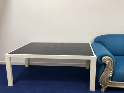 White Square dinningtable with Dark glass Top and wooden sides very Good Condition