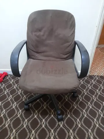 Brown swivel office chair with armrests, used