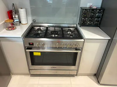 Bosch stainless steel freestanding gas range with electric oven - good condition