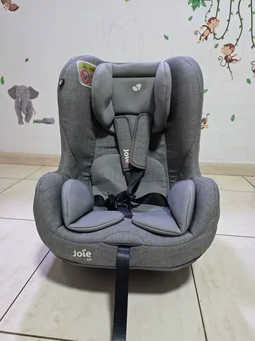 Joie Tilt Convertible Car Seat with Side Impact Protection and Seat Belt System.
