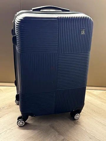 FREE Dark blue hard-shell spinner suitcase - medium/large, gently used