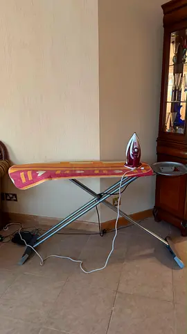 Ironing board with steam iron and cover - good working condition