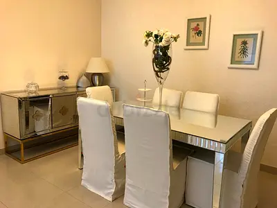 Mirrored Glass Dining Table with 6 White Slipcovered Chairs