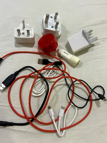Mixed phone chargers, USB cables and travel plug adapters