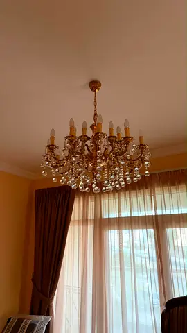 Crystal chandelier light fitting with gold finish — good condition