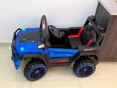 Battery-Powered Kids Ride-On Off-Road Car - Blue/Black, Good Condition