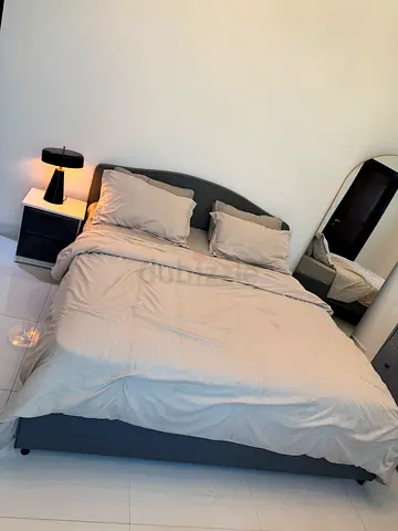 Gray upholstered double bed frame from IKEA Queen size. Bed has been dismantled for collection
