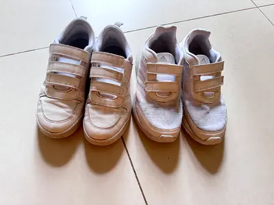 Two Pairs of White Adidas Sneakers