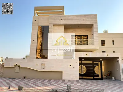 Villa for sale in the Al Amra area, Ajman—prime location near all amenities. Features a built-up area of ​​4,400 sq. ft. across two floors plus a roof