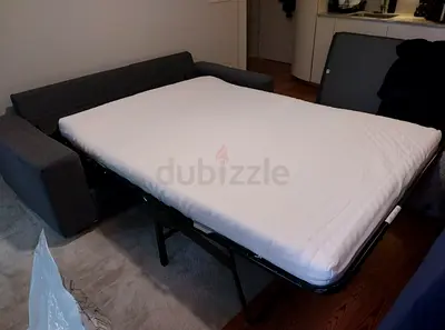 Grey fabric sofa bed with pull-out mattress - good condition