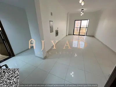 Annual rent in Ajman: 2BR with open street-view balcony and central AC, in a vibrant area near all services and Dubai & Sharjah exits.