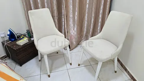 Set of 2 white upholstered dining chairs — used, good condition