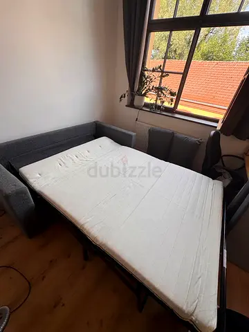 Grey fabric sofa bed with mattress - good condition