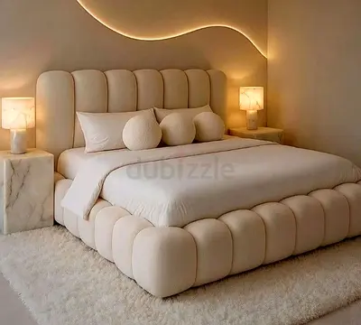Beige upholstered plush bed frame with padded headboard