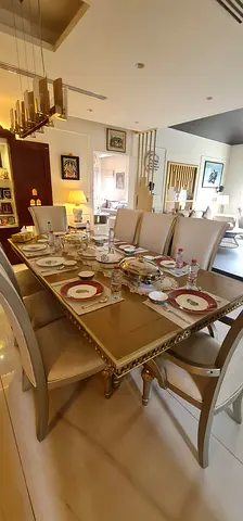 Al Huzaifa Solid wood dining table with 8 upholstered chairs. Console and Mirror Included.