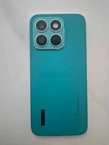 Mint green smartphone with quad camera - good condition