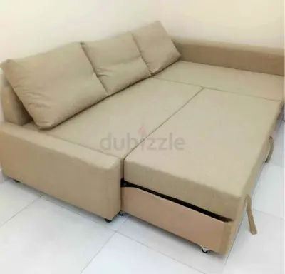 Beige L-shaped Sofa Bed with Pull-out Storage - Good Condition