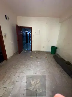 1-bedroom apartment for annual rent in Al Shuwaiheen, near the Corniche. The apartment features a co