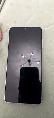 Samsung Galaxy A06 phone with cracked screen - used