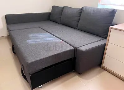 Grey L-Shaped Sofa Bed with Pull-Out Section