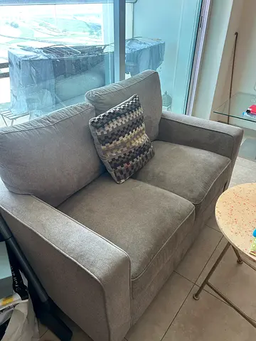 Compact 2-seater grey sofa in good condition