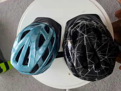 Pair of kids bicycle helmets - good condition (black & blue)