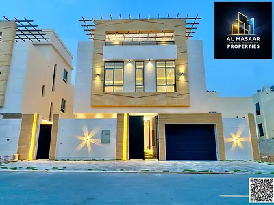Modern villa with high-quality custom finishing for sale in Ajman; includes electricity, water, and air conditioning. Freehold ownership available to