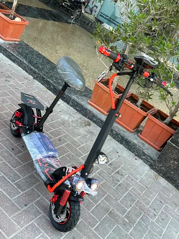 Electric Scooter with Seat, Dual Suspension and LED Lights -